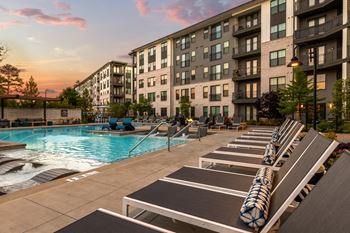 Resort-style saltwater swimming pool with tanning ledges and sundeck
